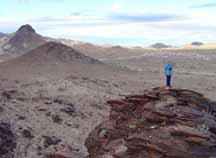 Top of hill with RVs in far background